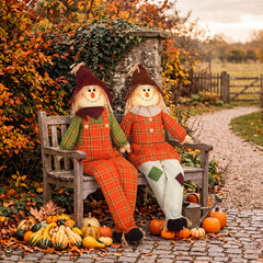 Two Libima large scarecrows sitting together