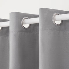 Two TOWN & COUNTRY BASICS Cabana Solid Heavyweight Curtain Panels displayed outdoors