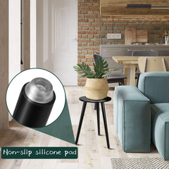 Uneedem plant stand used as a small table beside a sofa