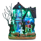 Valery Madelyn Halloween Village House front view with colorful lights