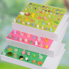 Variety of U-Zimikee miniature animal figures in colourful display