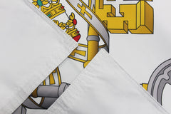 Vatican Flag displayed in a garden setting
