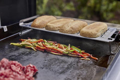 Weber Griddle Keep Warm Rack side view showing collapsible legs