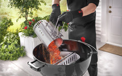 Weber Rapidfire Chimney Starter filled with charcoal ready for use