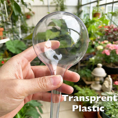 Wellinc self watering globes inserted in various potted plants