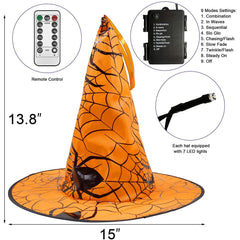 Witch hats hanging in a garden setting with lights on