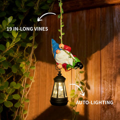 WONDHOME gnome hanging from tree branch with lantern glowing