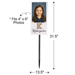 Yard sign featuring school photos from Kindergarten to 12th grade