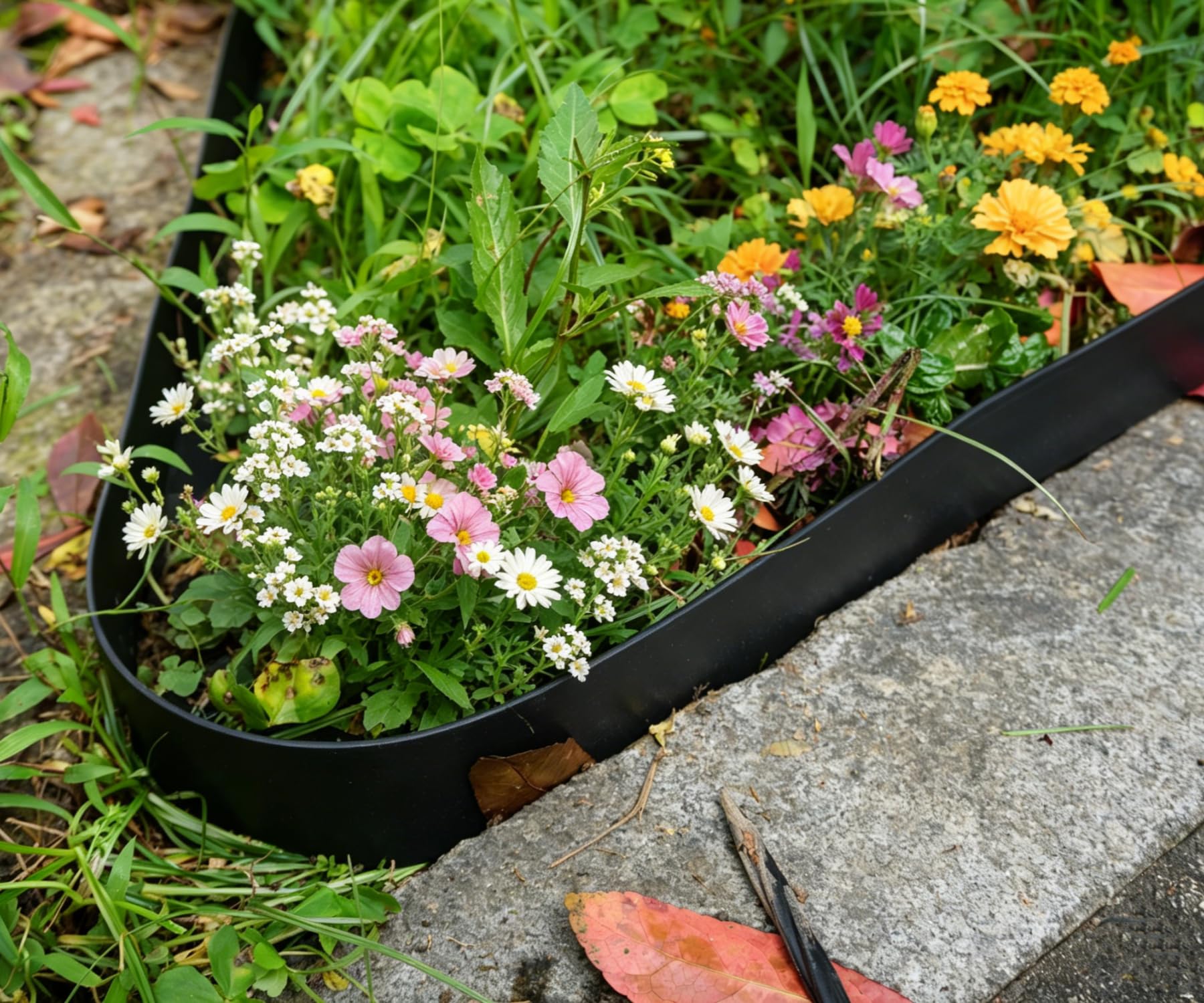 A garden scene featuring A ANLEOLIFE edging around flower beds