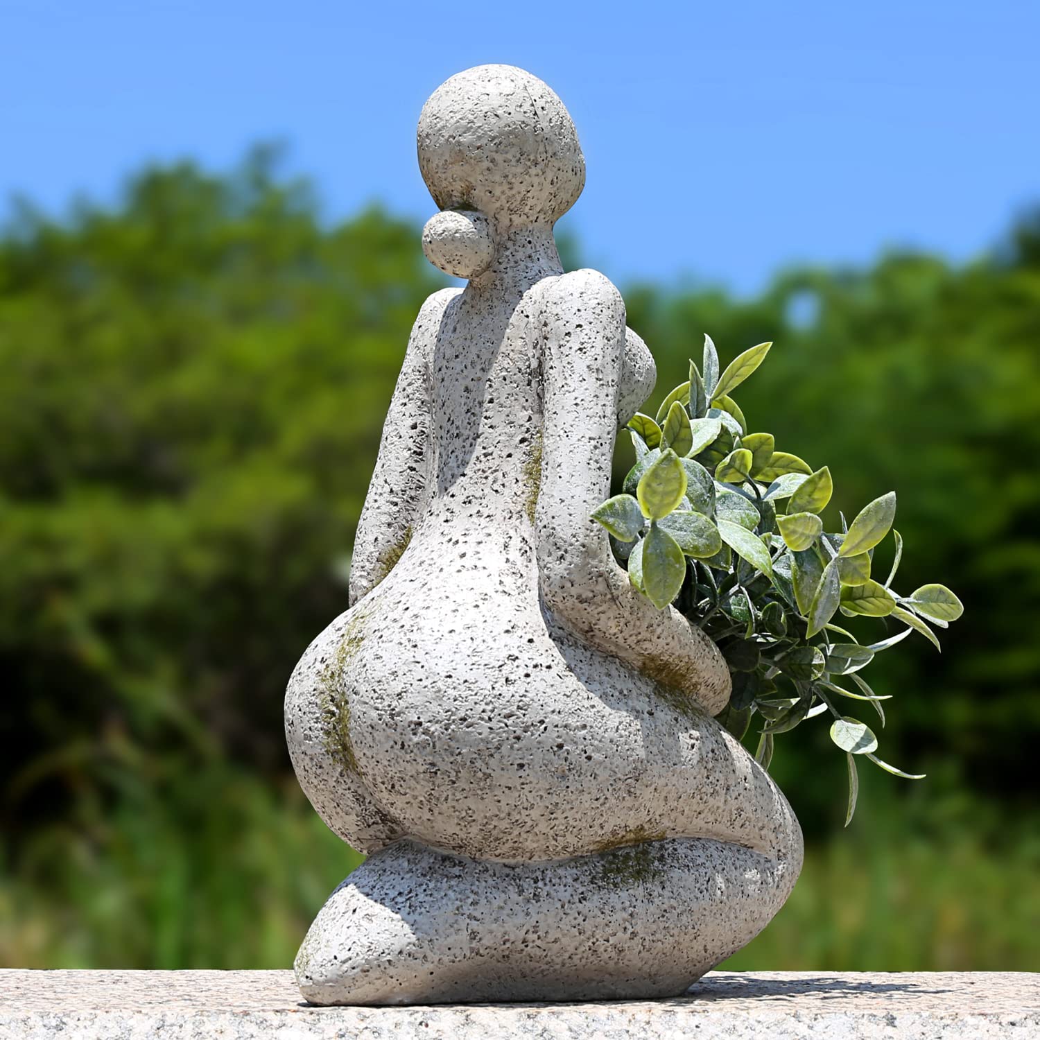Aclema Face Planter in a garden setting with flowers
