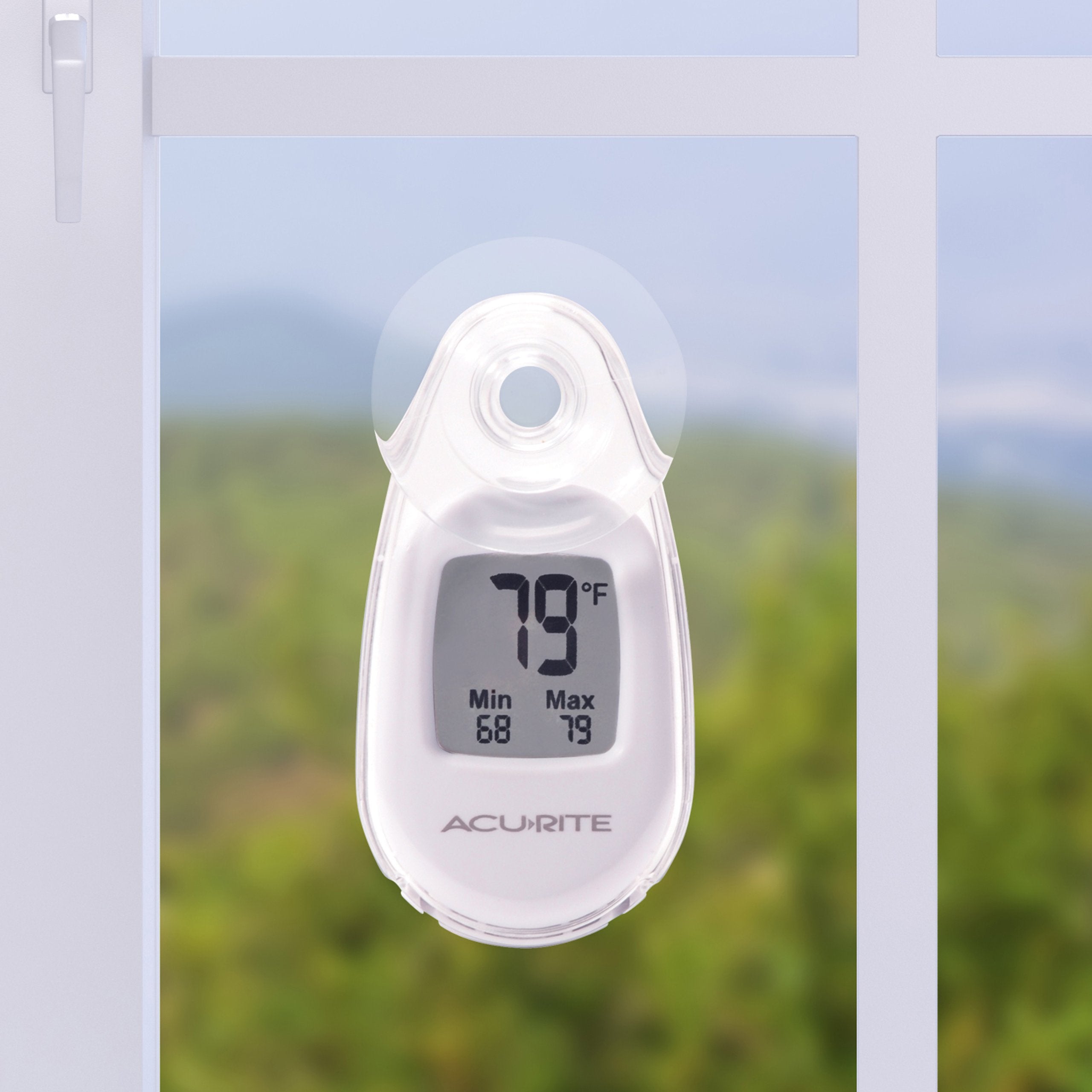 AcuRite thermometer displaying temperature with suction cup mounted