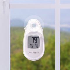 AcuRite thermometer displaying temperature with suction cup mounted