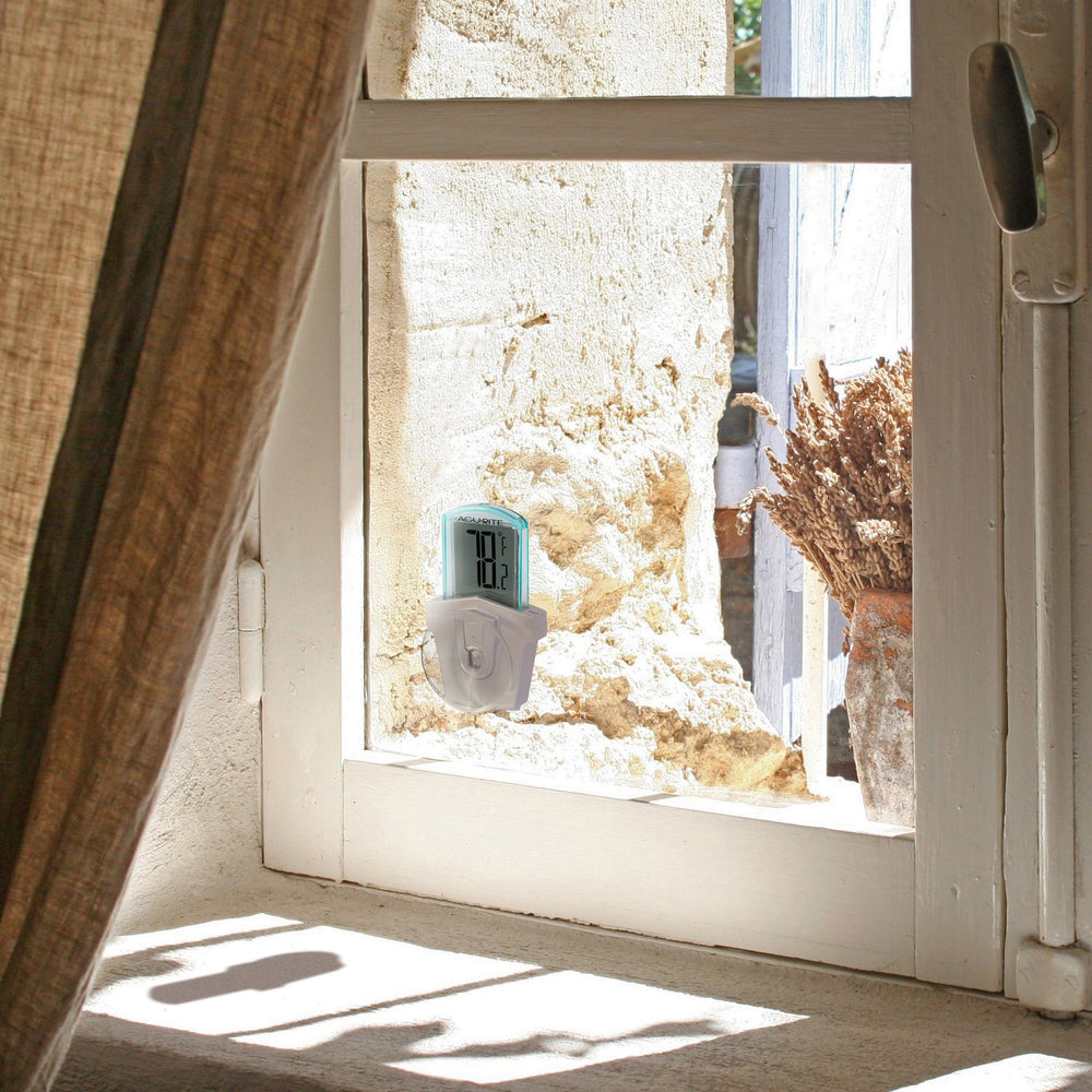 AcuRite thermometer mounted on a window