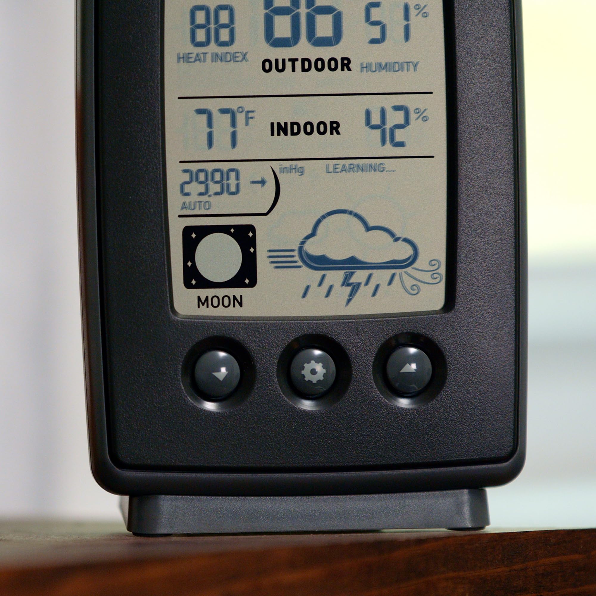 AcuRite weather station on a countertop in a home setting
