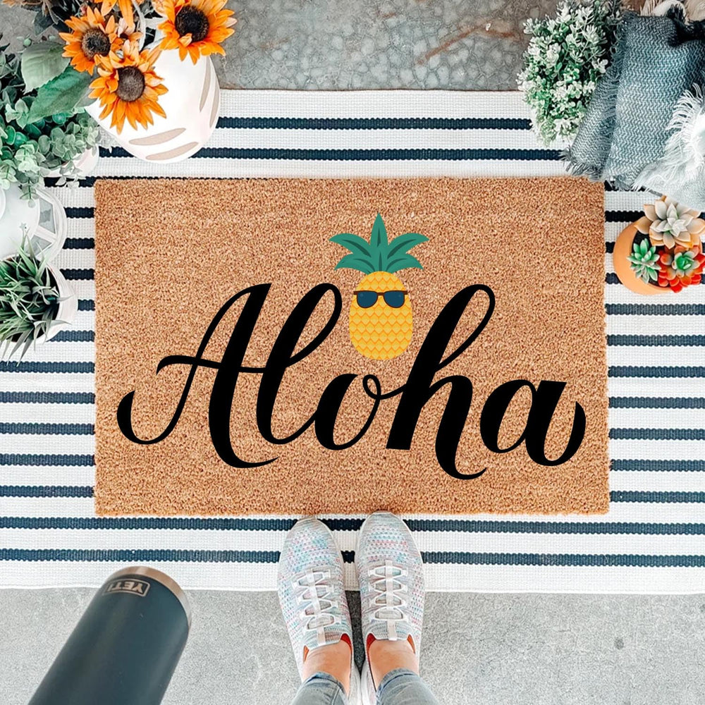 Aloha Pineapple Doormat with decorative elements around it