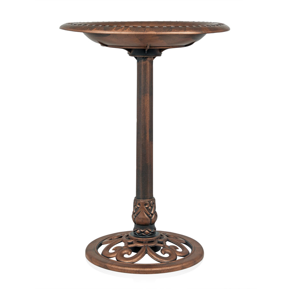 Alpine birdbath with water and flowers around it