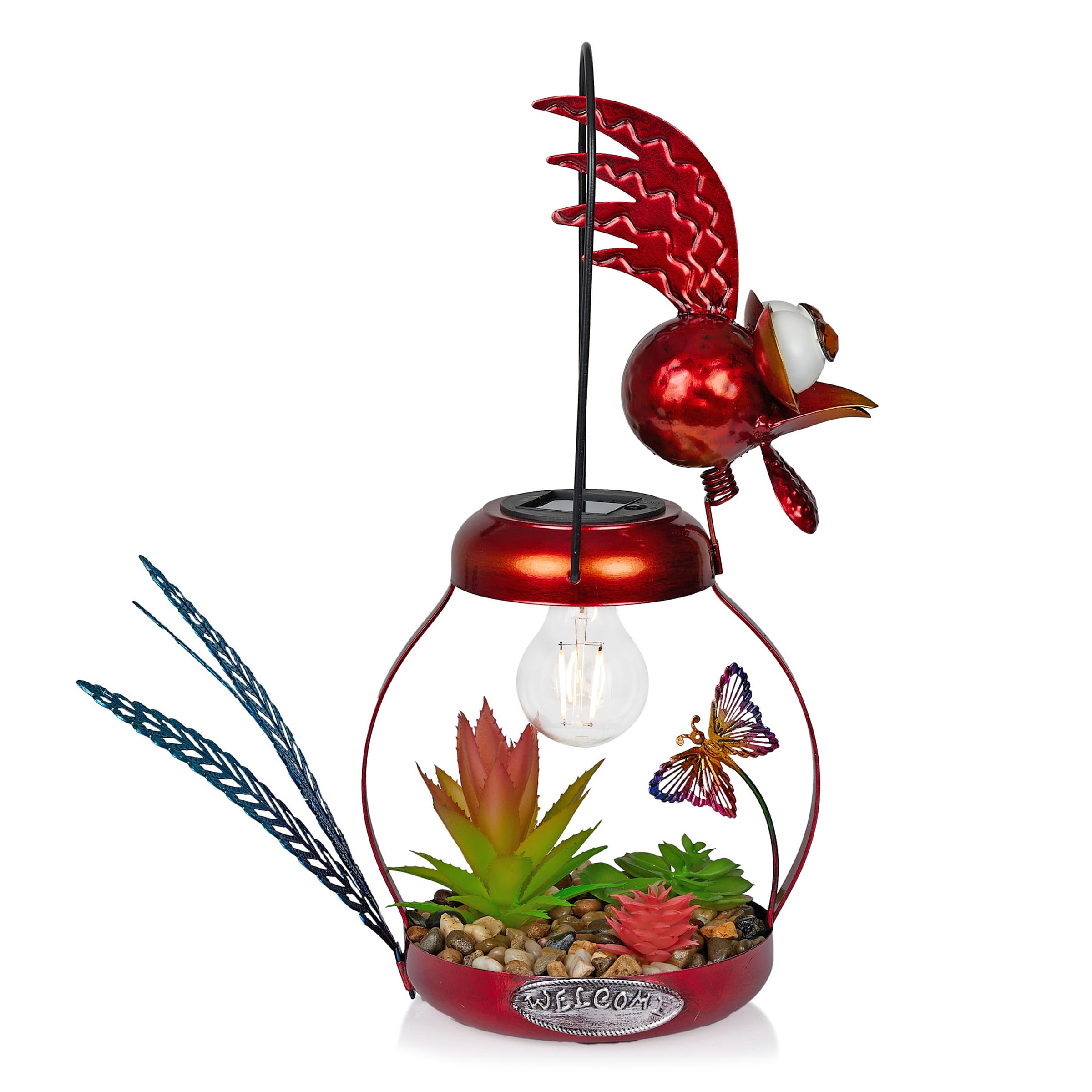 Alpine Solar Rooster in flower bed with warm glow