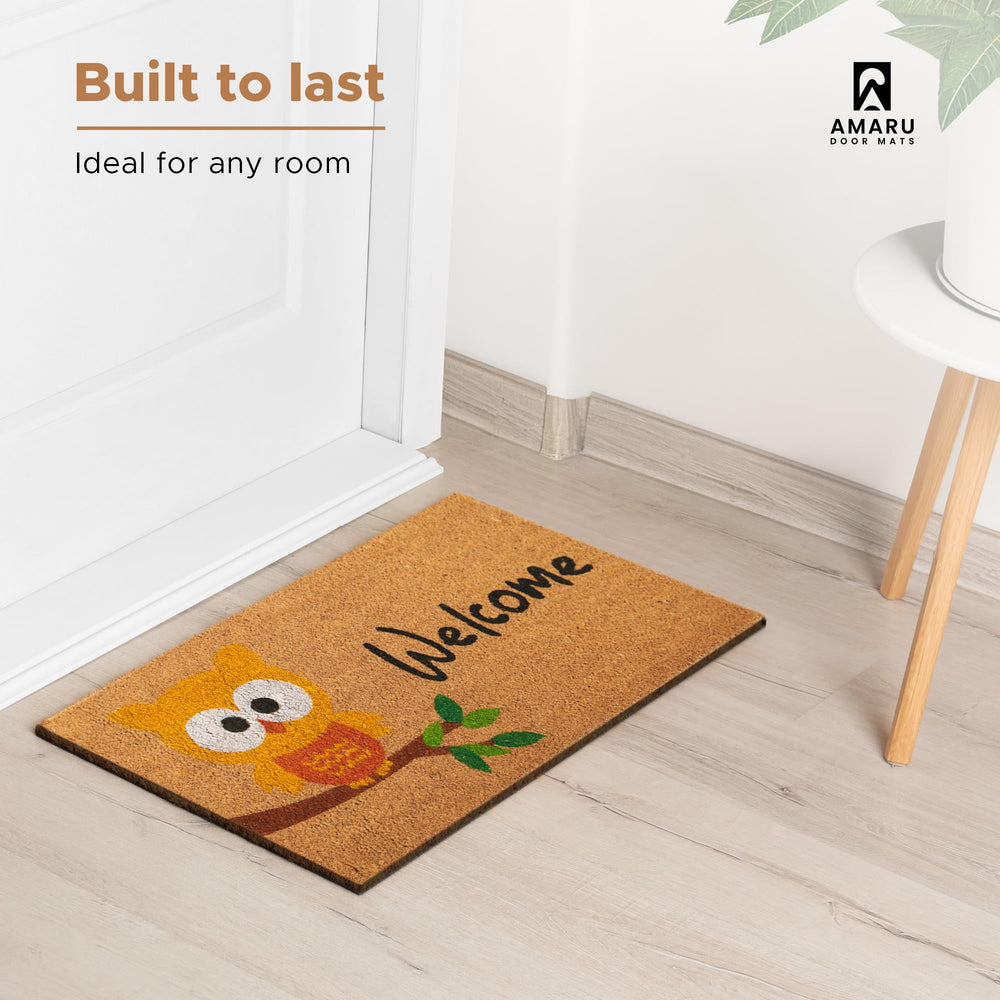 AMARU Coir Welcome Mat in a garden setting