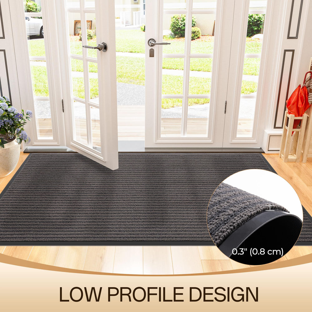 Amyracel doormat being cleaned with a hose
