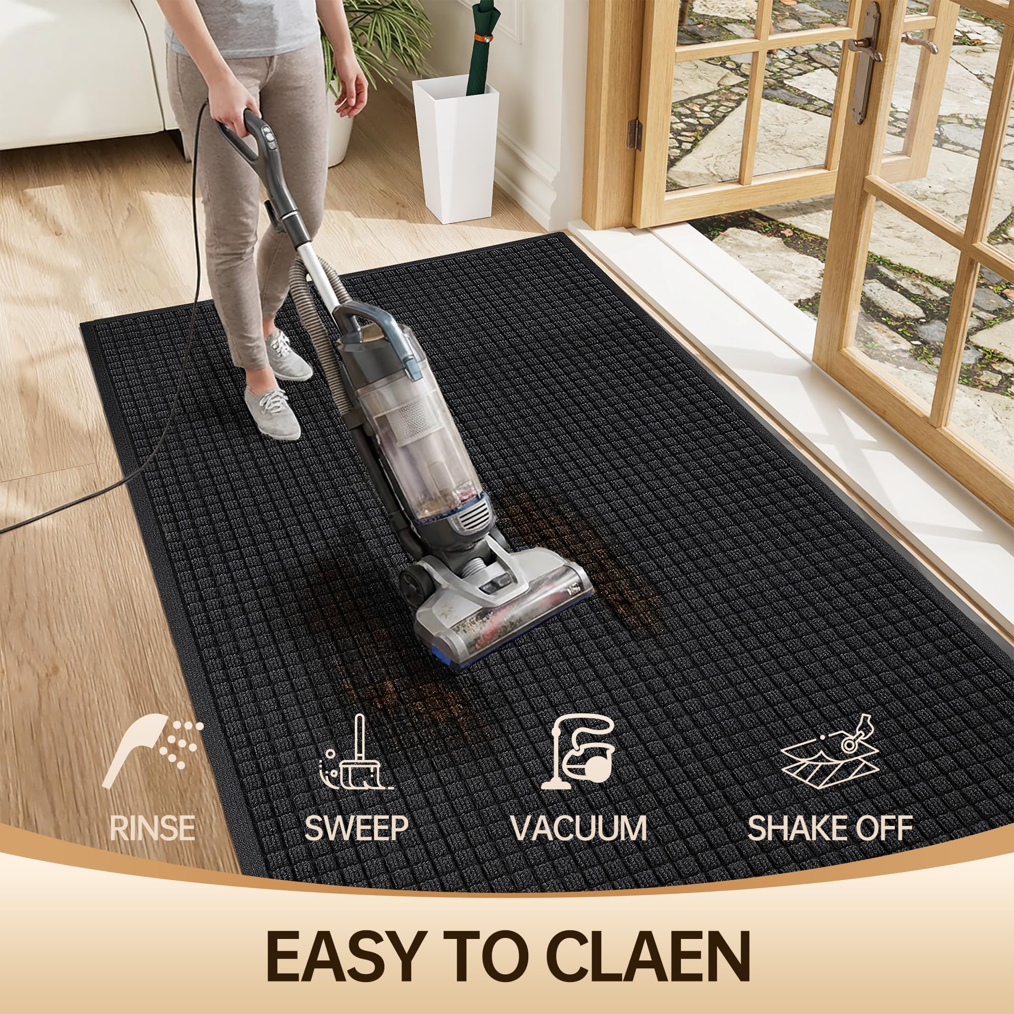 Amyracel front door mat being cleaned with a hose