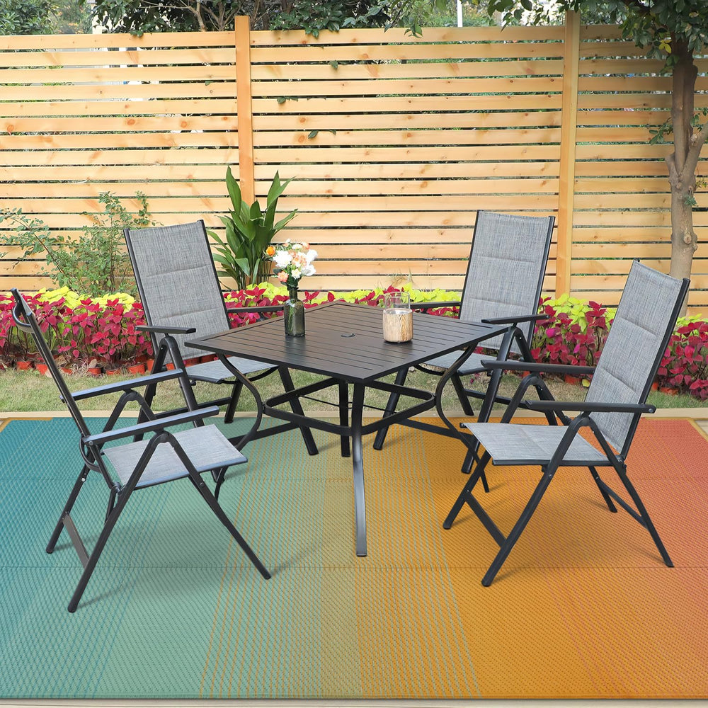 Anidaroel 6x9ft rug laid out on patio with furniture