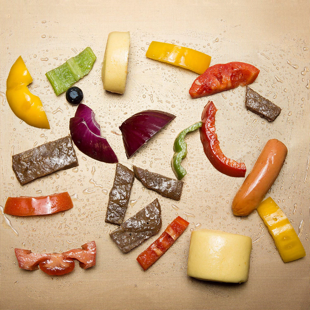 Aoocan Copper Grill Mat in use with grilled vegetables