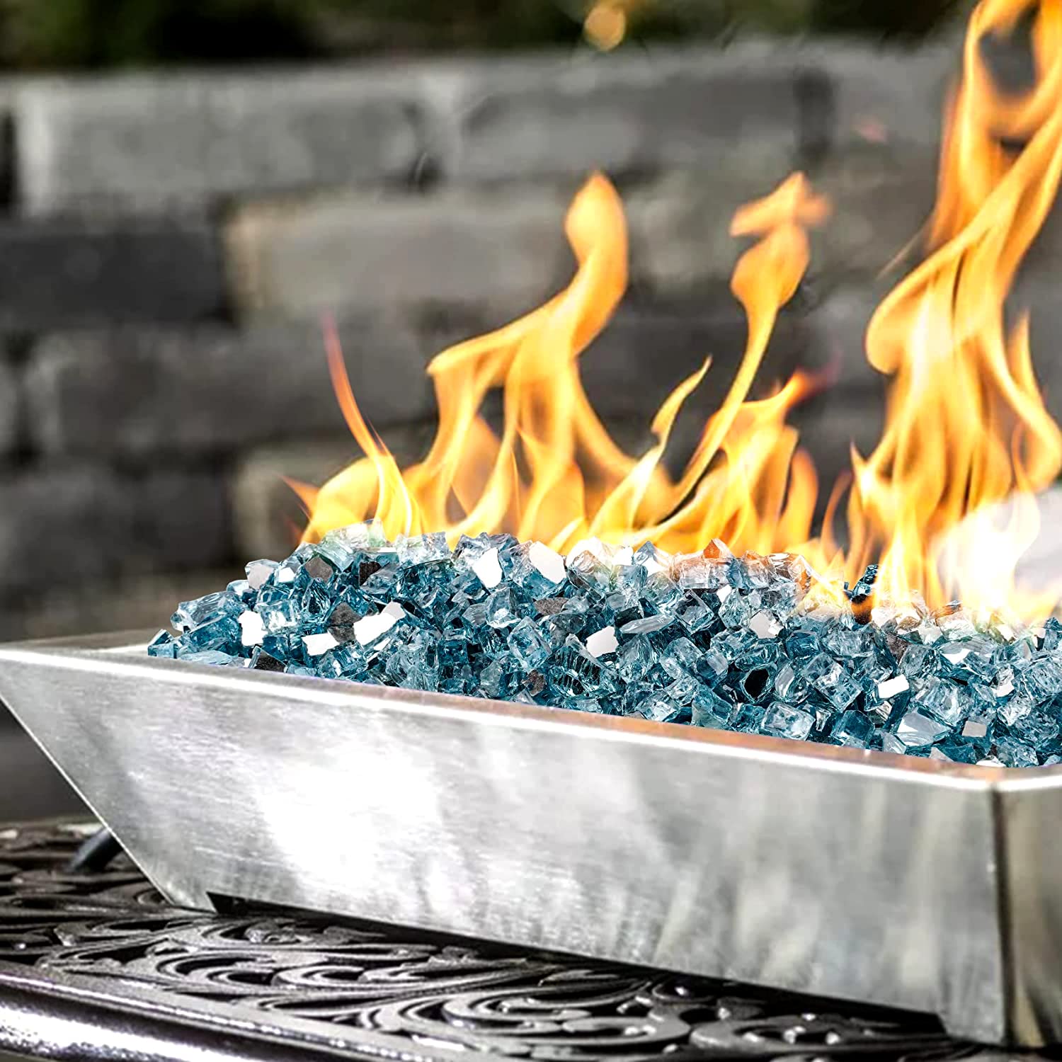 Aqua Blue fire glass displayed in a fire pit