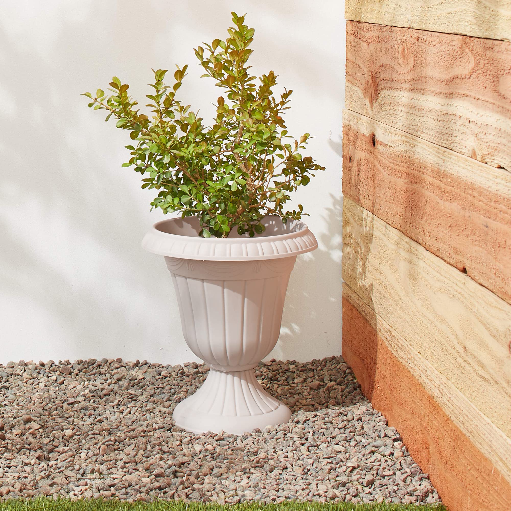 Arcadia Garden Products urn planter with flowers in it