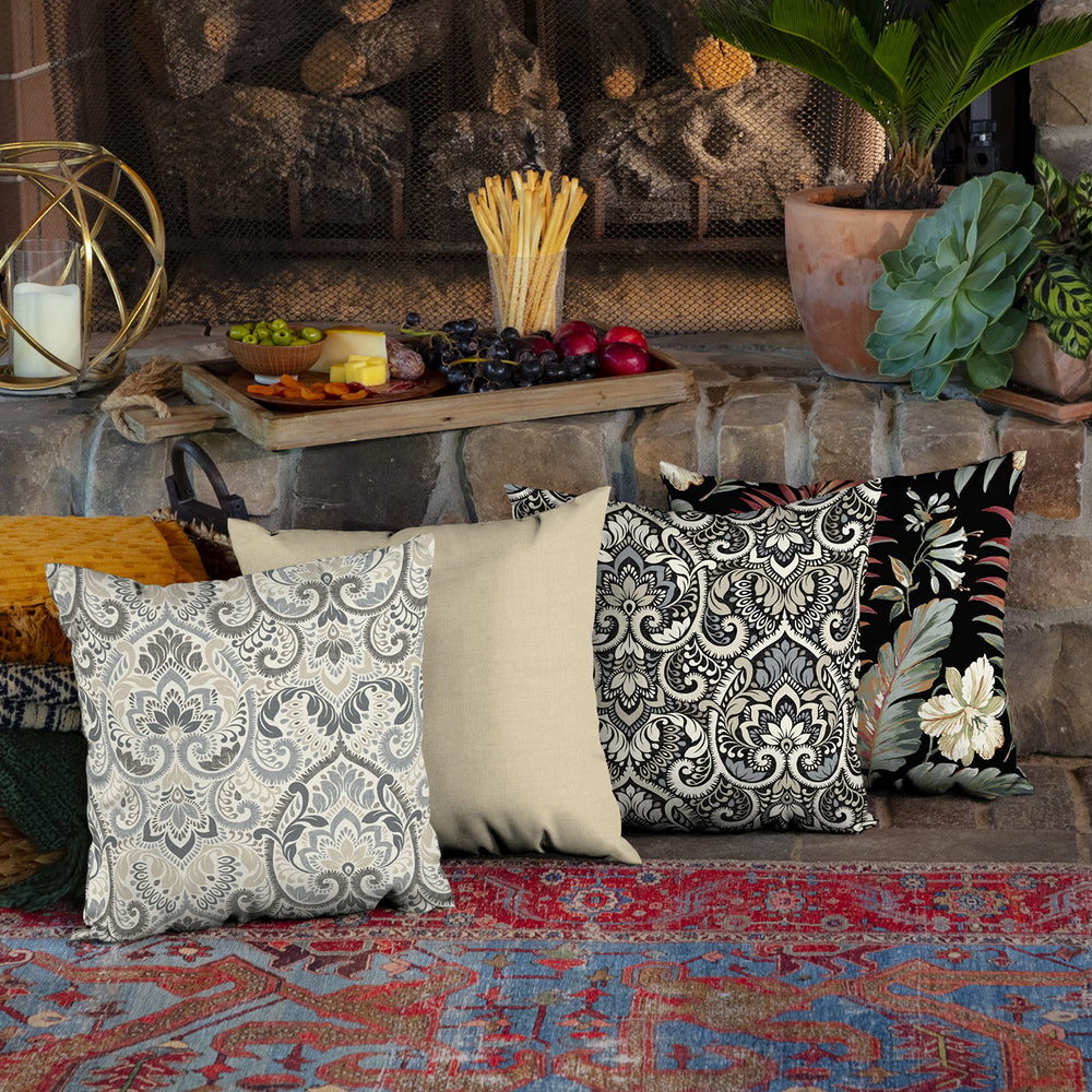 Arden Outdoor Toss Pillow in a garden setting