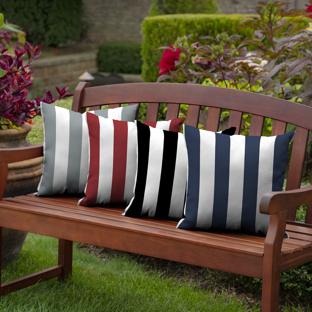Arden Selections Outdoor Toss Pillow outdoors on a patio chair