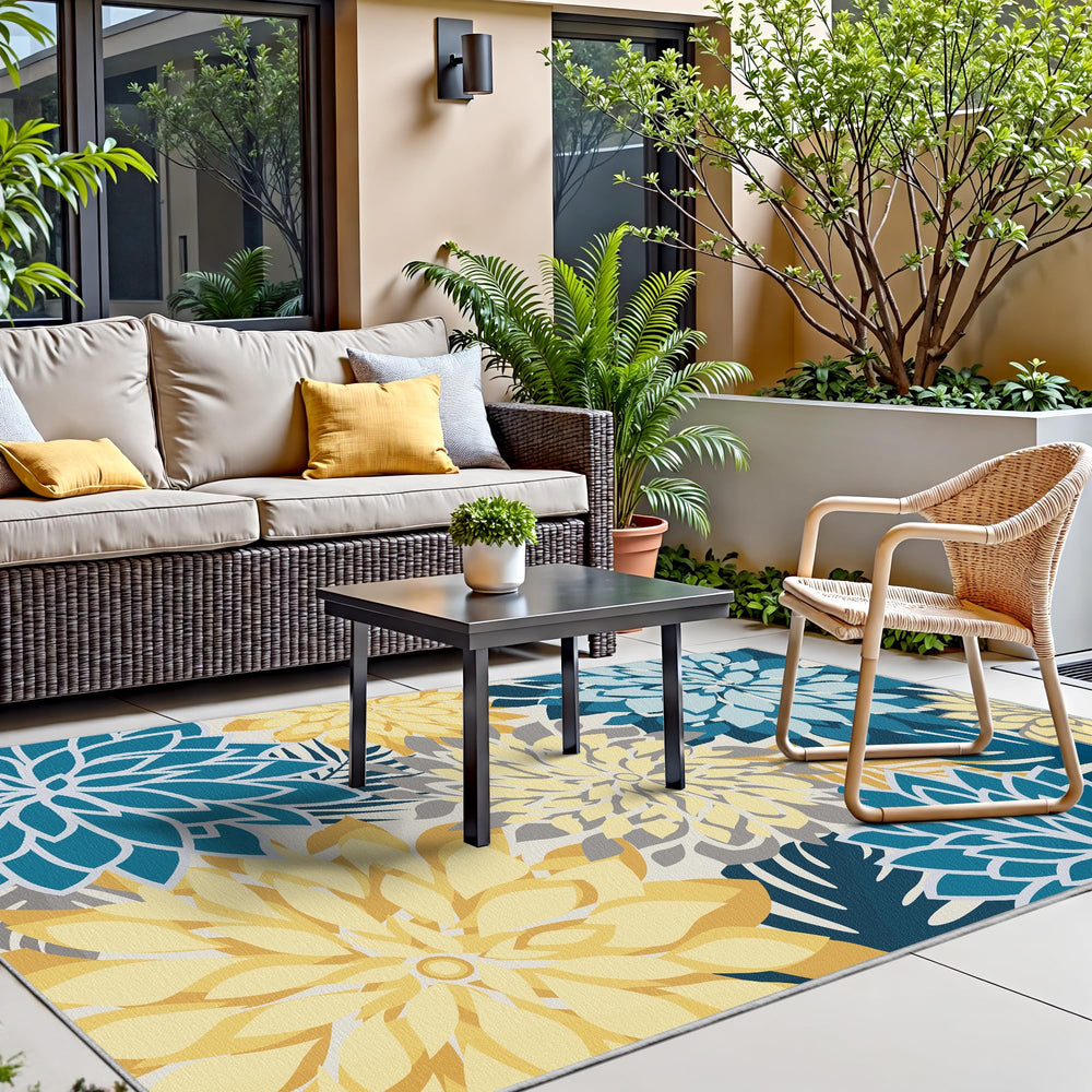 Arenarug Outdoor Rug 4' x 6' Ocean Dahlia being cleaned