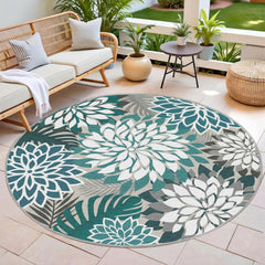Arenarug Outdoor Rug 6' Round Teal Floral Pattern in a garden setting
