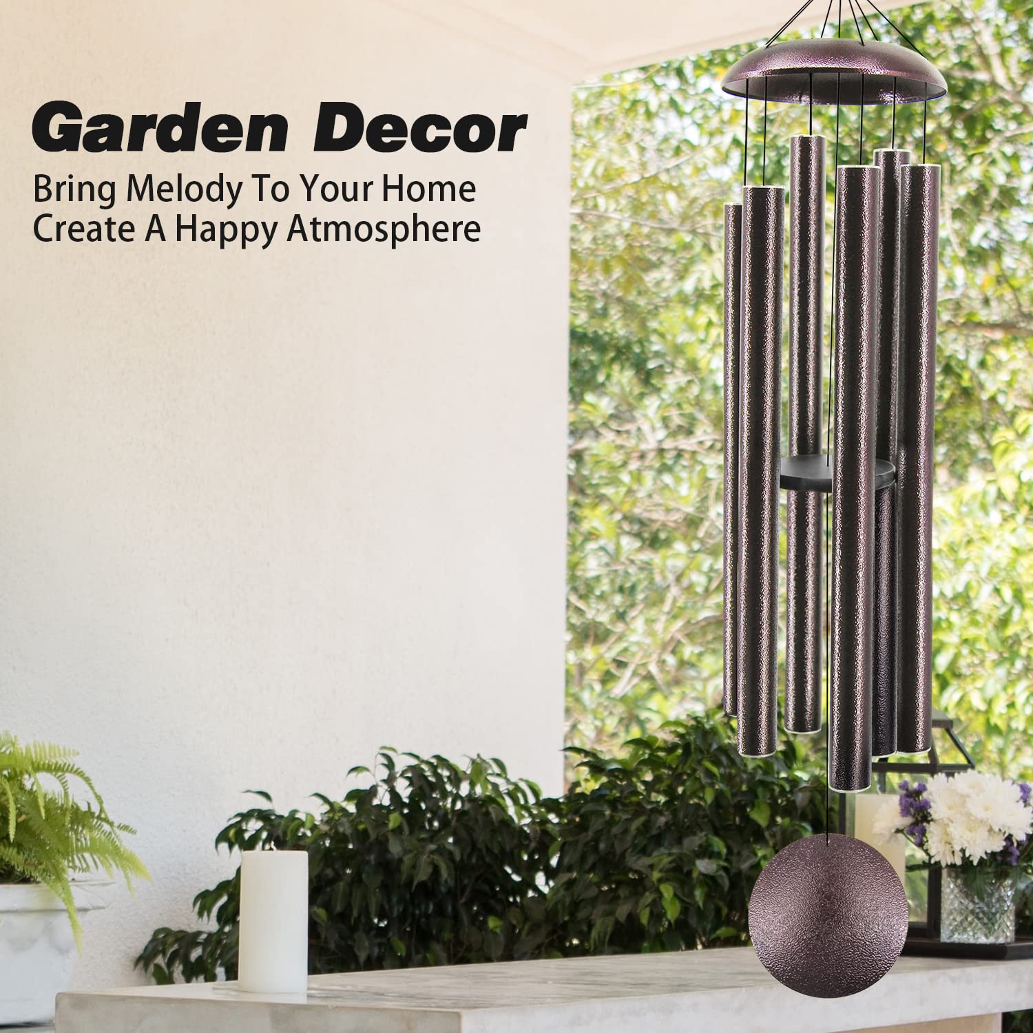 ASTARIN wind chimes with sunlight reflecting off the bronze finish
