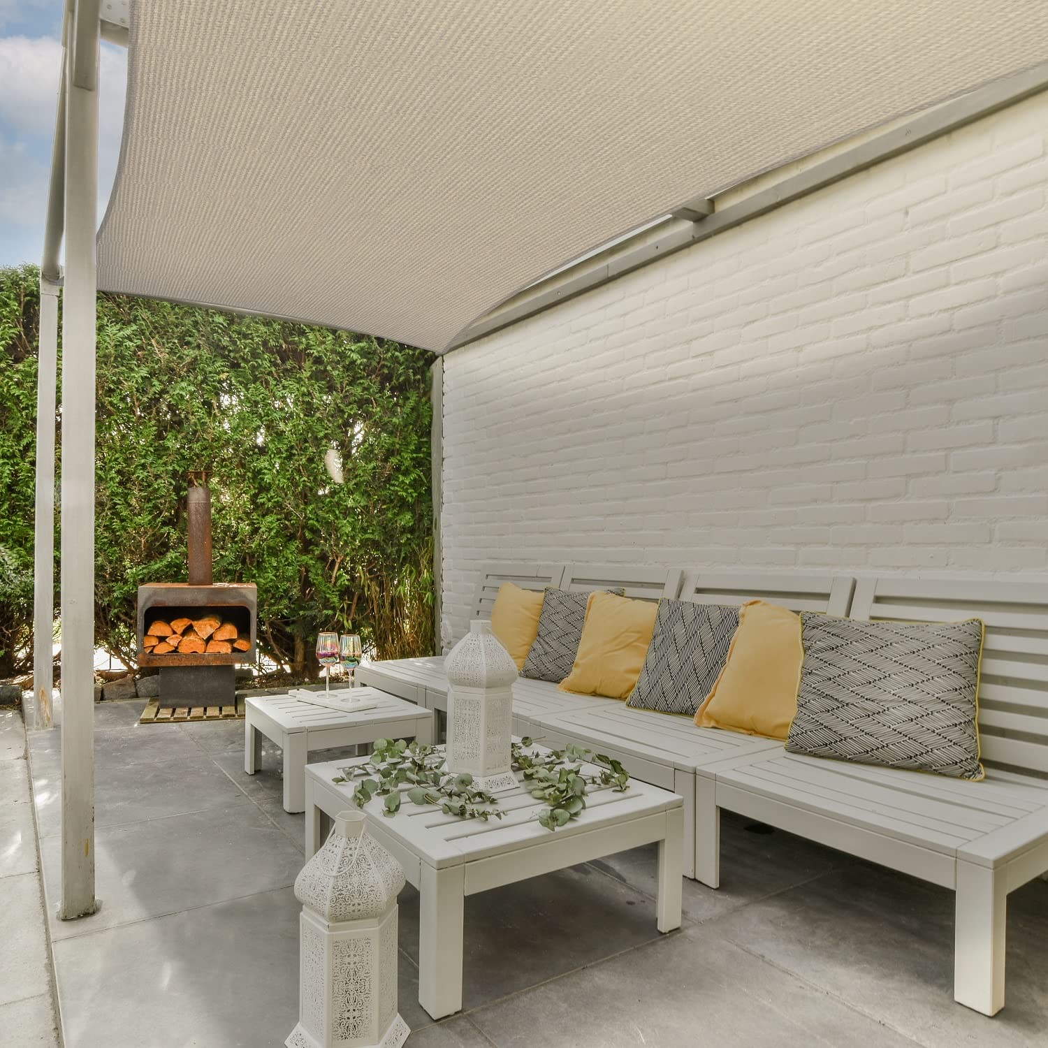 AsterOutdoor Sun Shade Sail attached to structure in garden