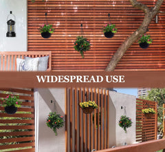 ASZUNE hooks installed on a wooden fence for hanging plants