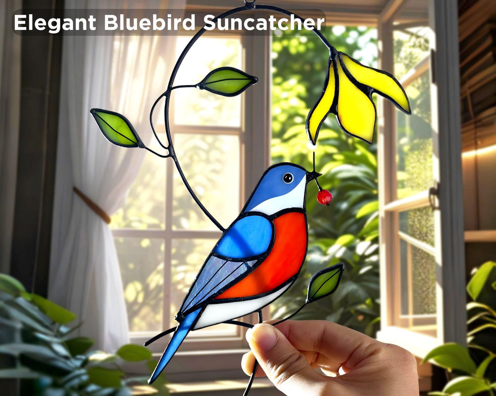 AuroAura Bluebird Stained Glass Suncatcher hanging in a sunny window