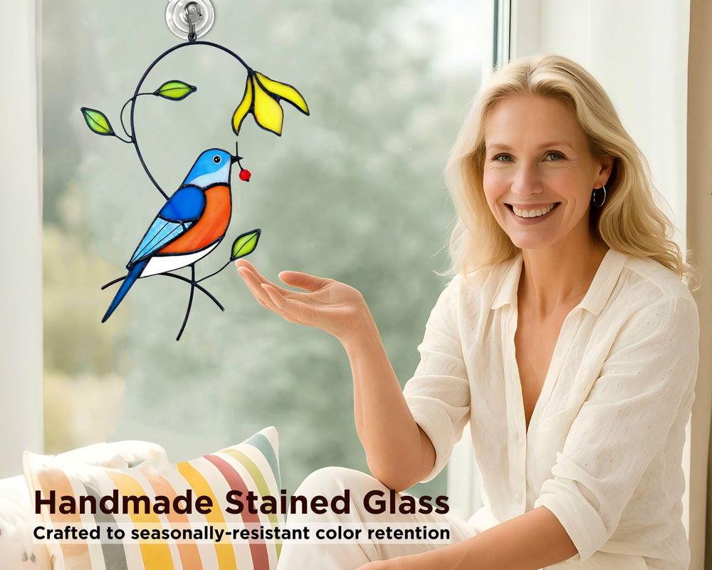 AuroAura Bluebird Stained Glass Suncatcher with rainbow reflections on a wall