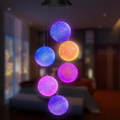 AWENDIETOU Solar Wind Chime illuminated at night