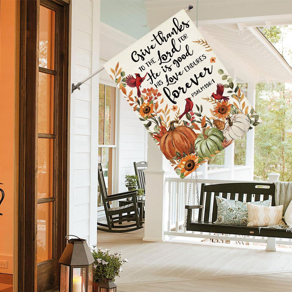 Baccessor Fall House Flag displayed on a porch