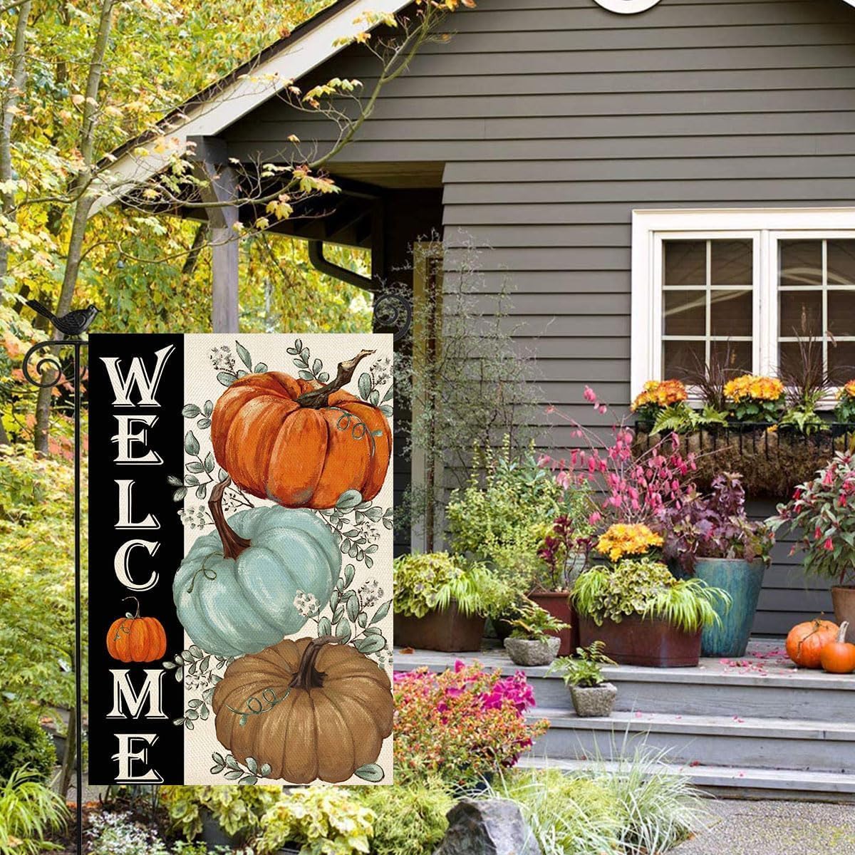 Baccessor Fall Pumpkins Garden Flag in a garden setting