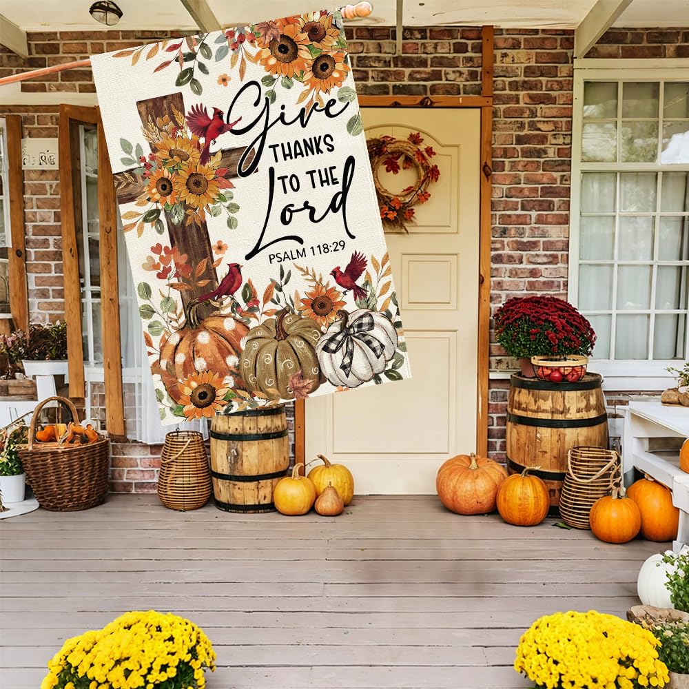 Baccessor flag displayed in a garden setting with fall foliage