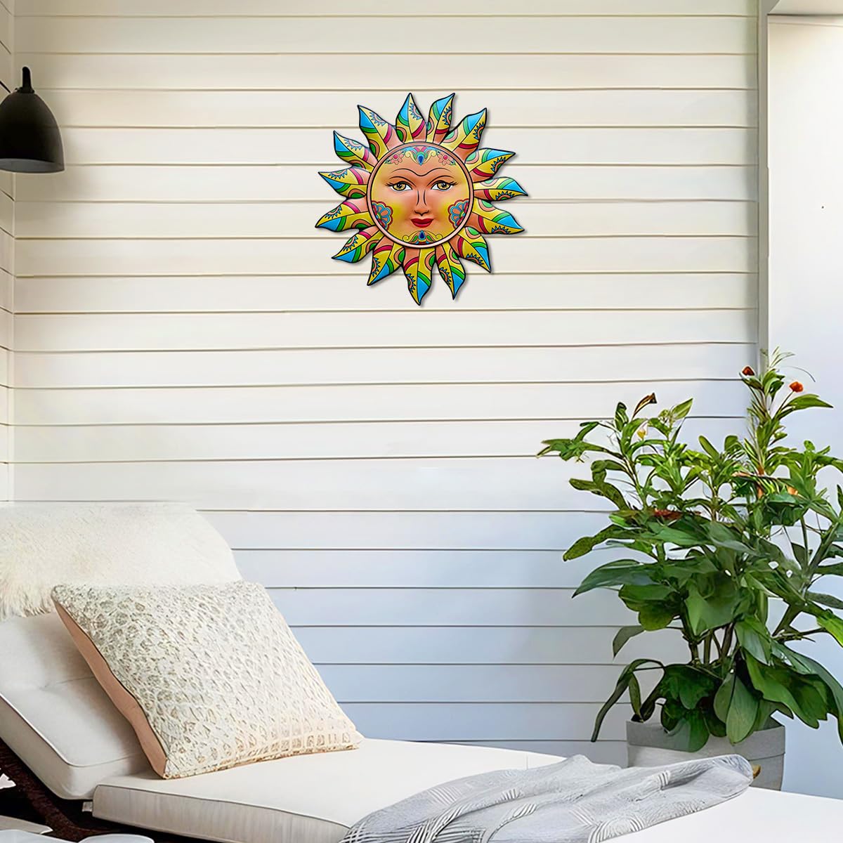 Back view of Daogtc Metal Sun Wall Decor showing the hanging hook