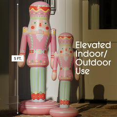 Back view of FUNBOY Pink Inflatable Nutcracker with support pole