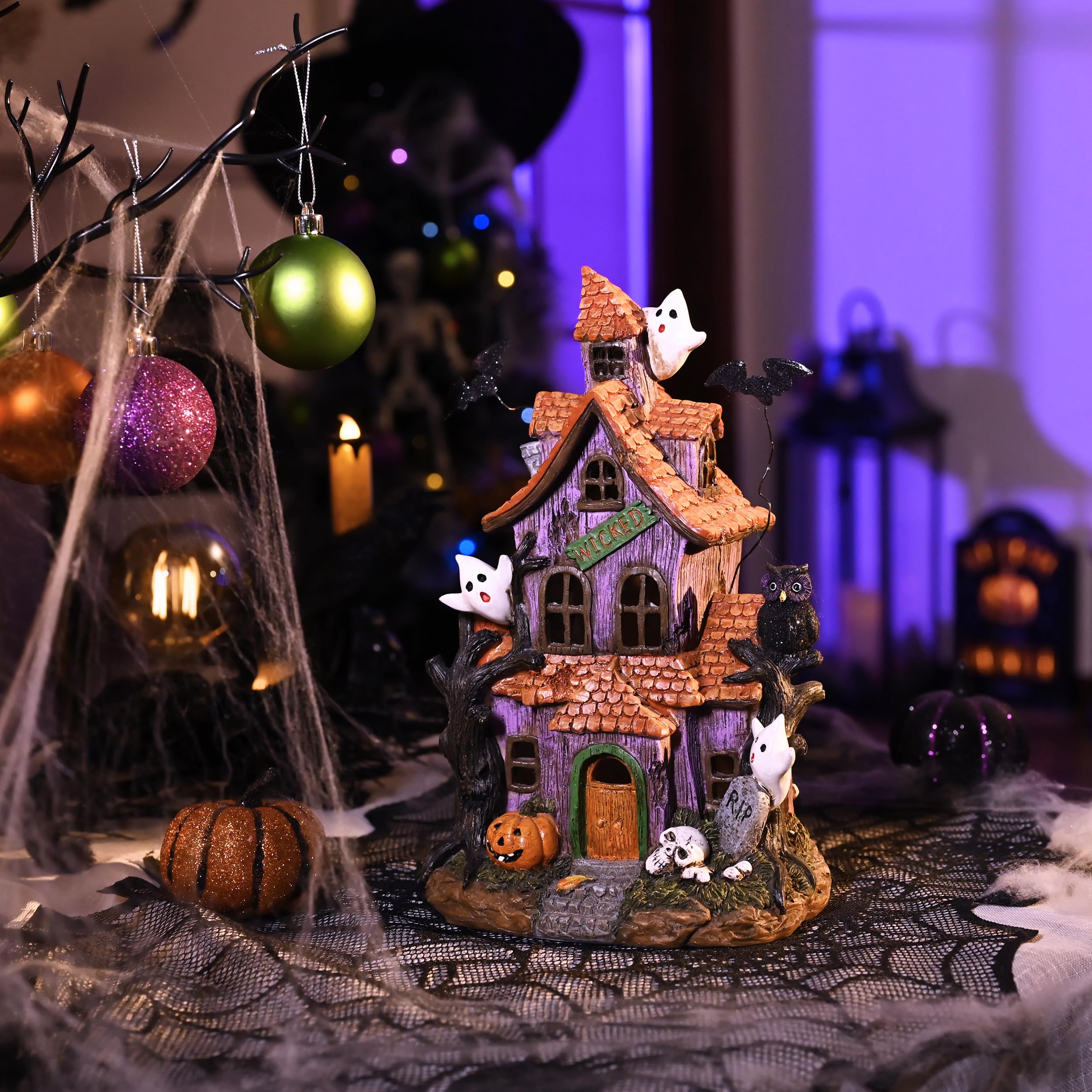 Back view of Valery Madelyn Halloween Village House with color-changing LED lights