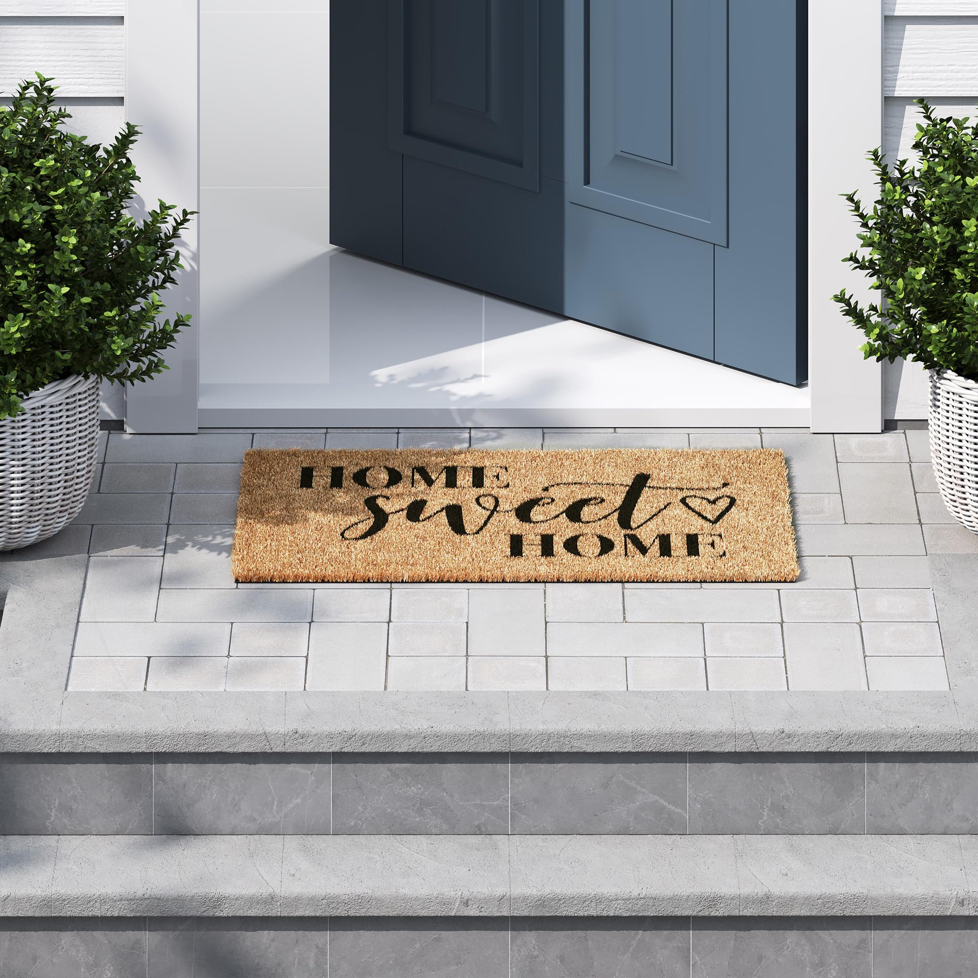 Barnyard Designs Home Sweet Home Doormat on wooden porch