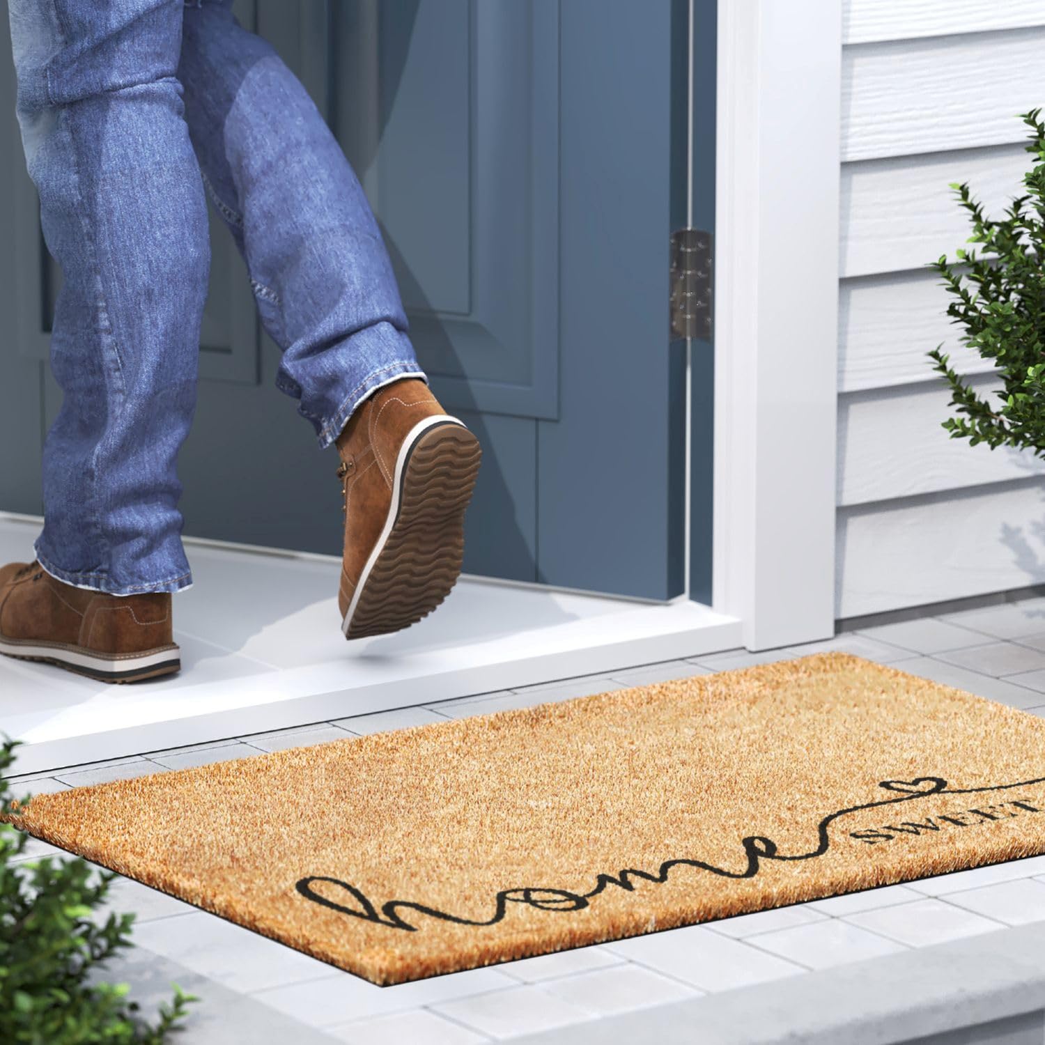 Barnyard Designs Home Sweet Home Doormat on wooden porch