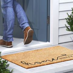 Barnyard Designs Home Sweet Home Doormat on wooden porch