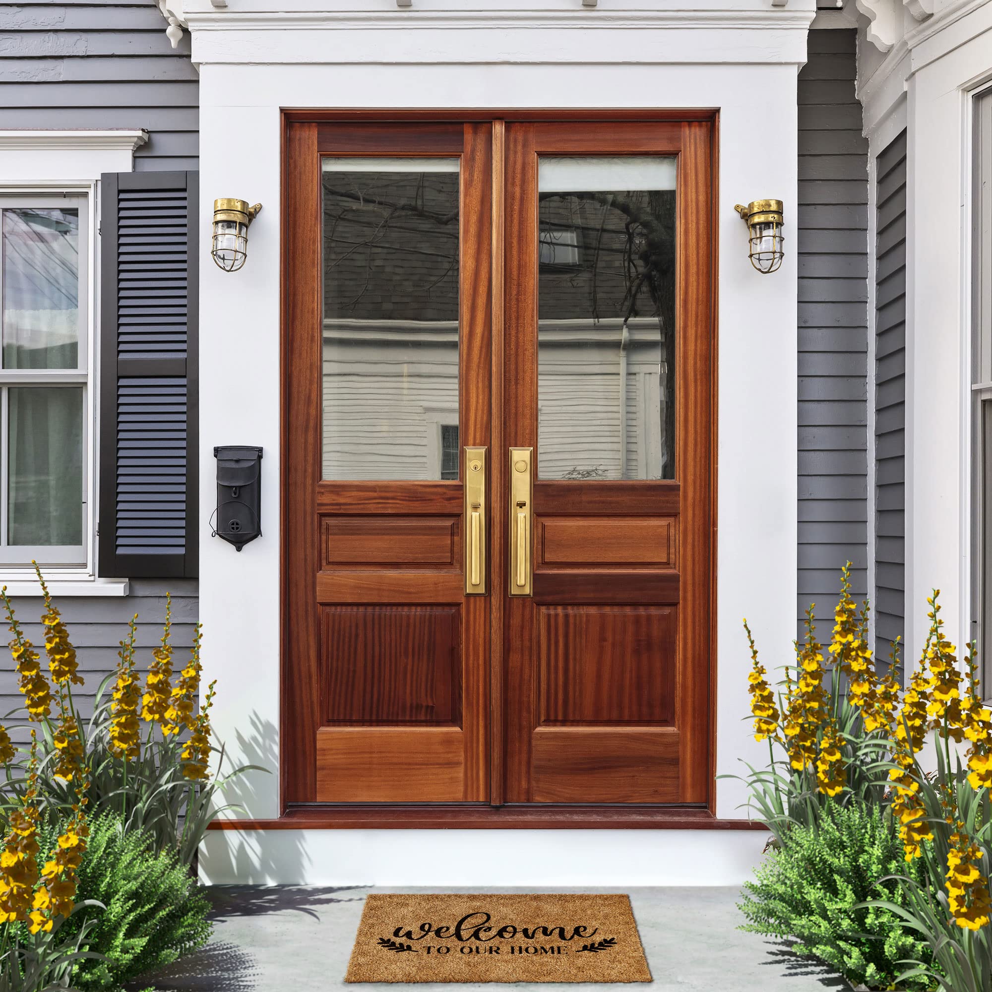 Barnyard Designs Welcome Mat displayed at a cabin entrance