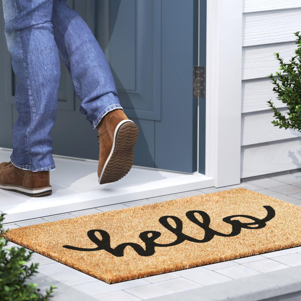 Barnyard Designs Welcome Mat displayed at a front door