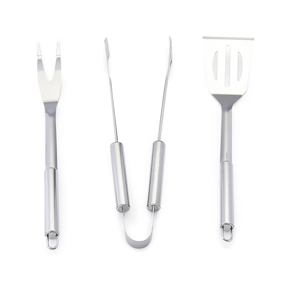Basics BBQ grilling tools laid out for outdoor cooking
